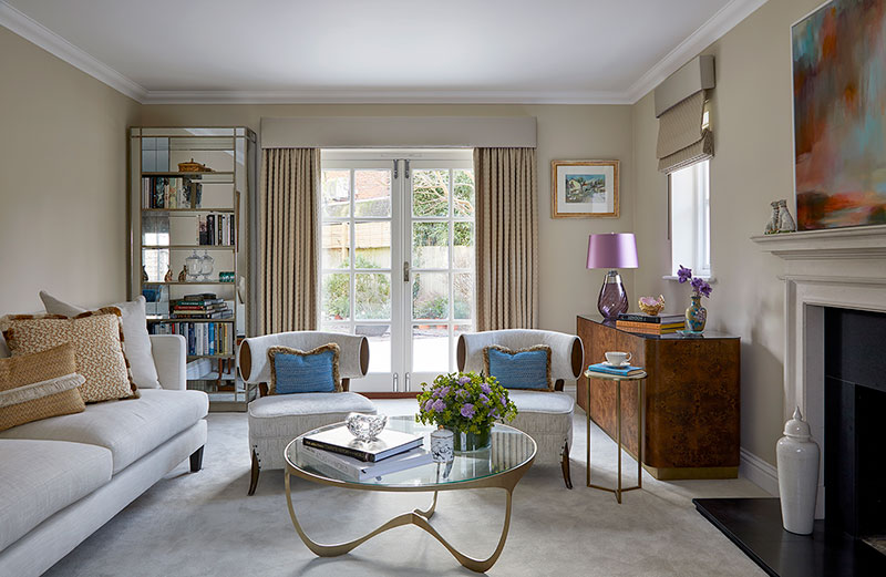 Fresh, graceful, and light-filled formal living room in Esher with layered fabrics and a subtle color palette